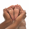 Hands and baby feet