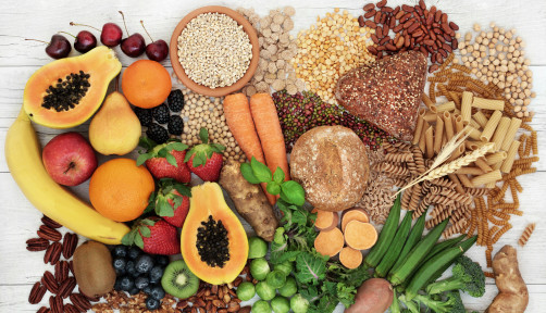 food with high fiber content for a healthy diet with fruit, vegetables, whole wheat bread, pasta, nuts, legumes, grains and cereals