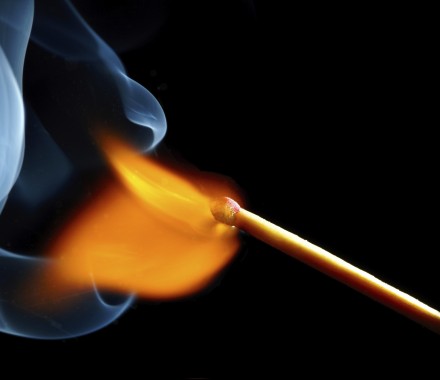 igniting match and smoke