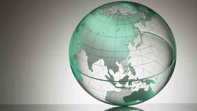 a transparent globe showing Asia