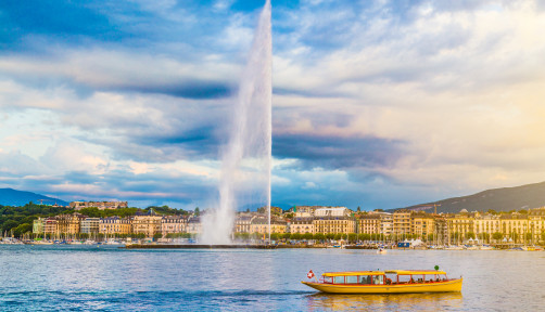 City of Geneva with Jet d'Eau fountain at sunset, Switzerland