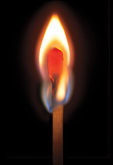 lit match on a black background